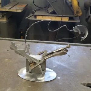 A metal object sitting on top of a table.