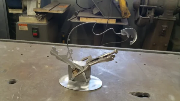 A metal object sitting on top of a table.