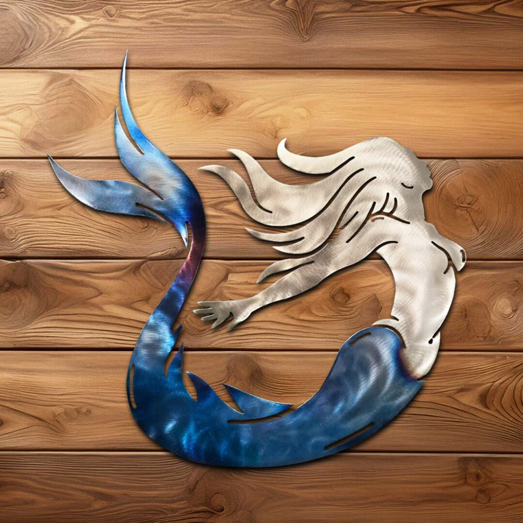 A metal mermaid with blue tail and white hair.