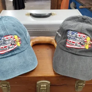 Two hats are sitting on a wooden box.