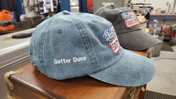 A close up of two hats on top of a table.